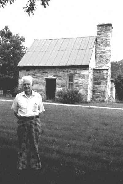 Caleb J. Moore stands in front of old Rock House Caleb J. Moore stands in front of old Rock House